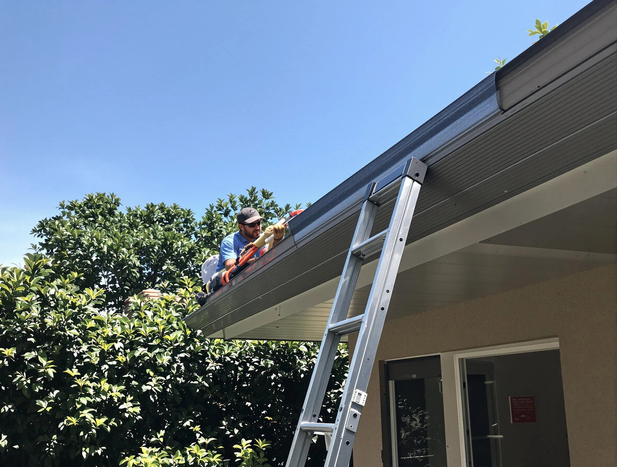 Lyndhurst Roofing Company installing gutter guards for a homeowner in Lyndhurst, OH